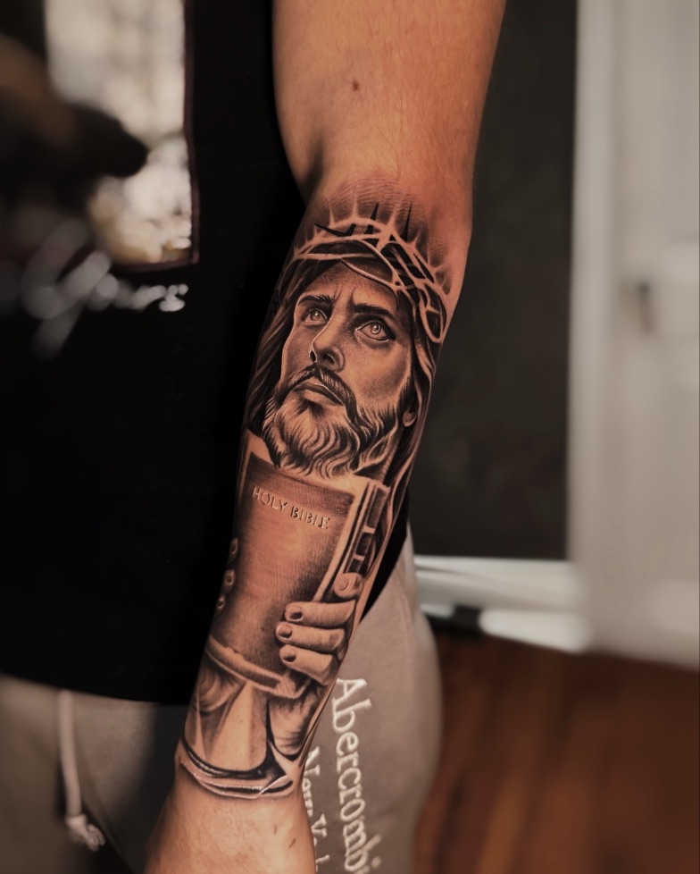 Holy Bible: Forearm, healed apart from the hair and crown. Tattoo by Vik.