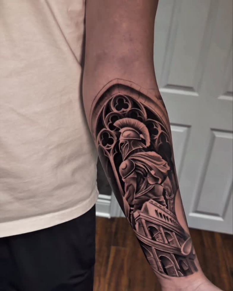 Spartan: Forearm, lower half healed. Tattoo by Vik.